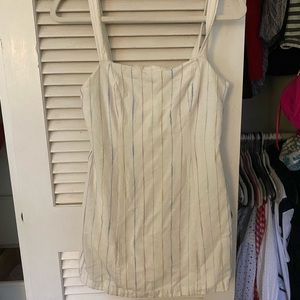 White dress with purple, blue and green accents.